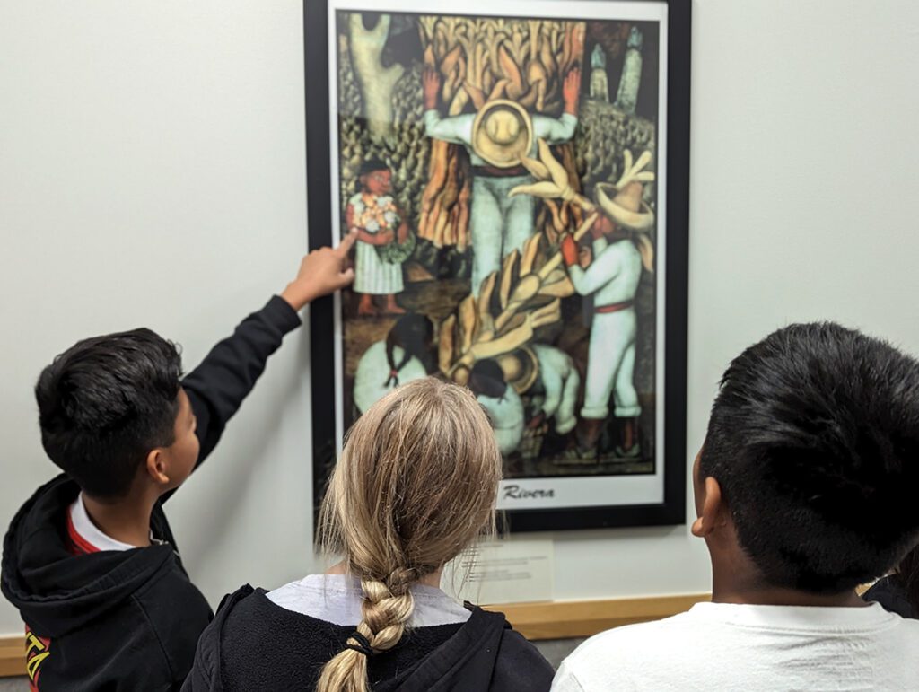 students looking at art