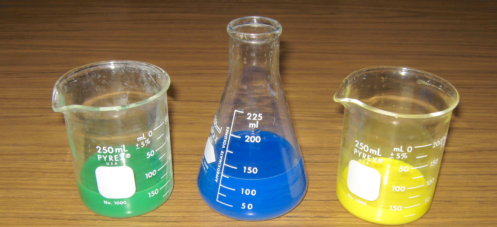 beakers with different colors of liquid