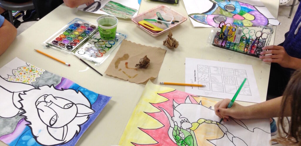photo of students working on a painting project
