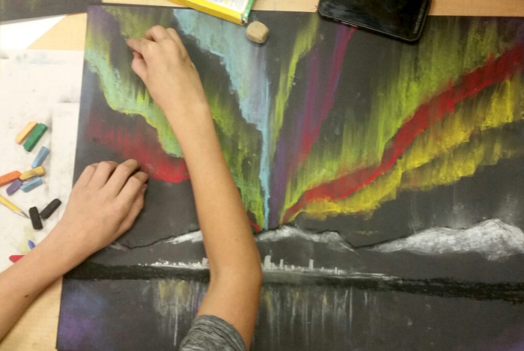 student working with chalk