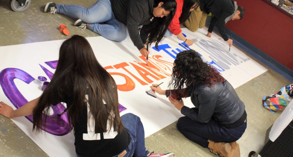 students making sign