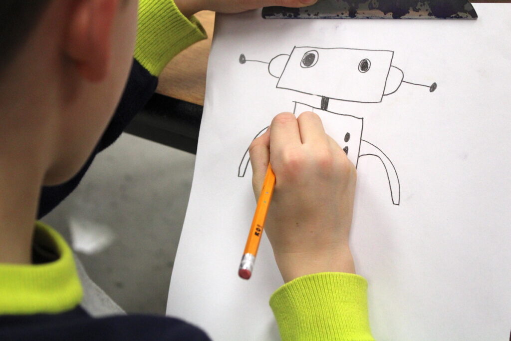 student drawing robot