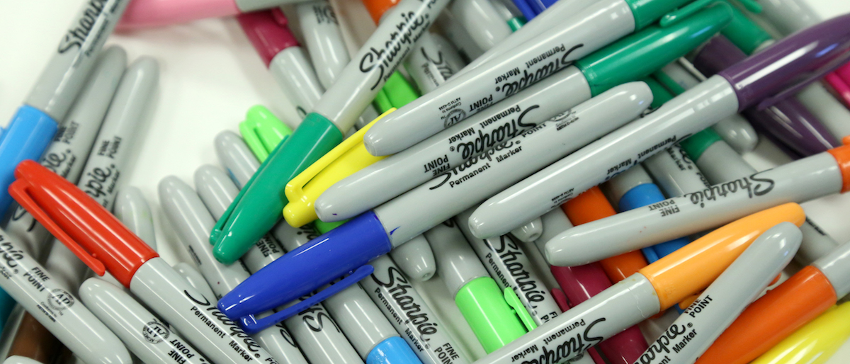 Sharpie markers in a pile