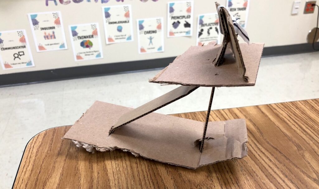 student working with cardboard