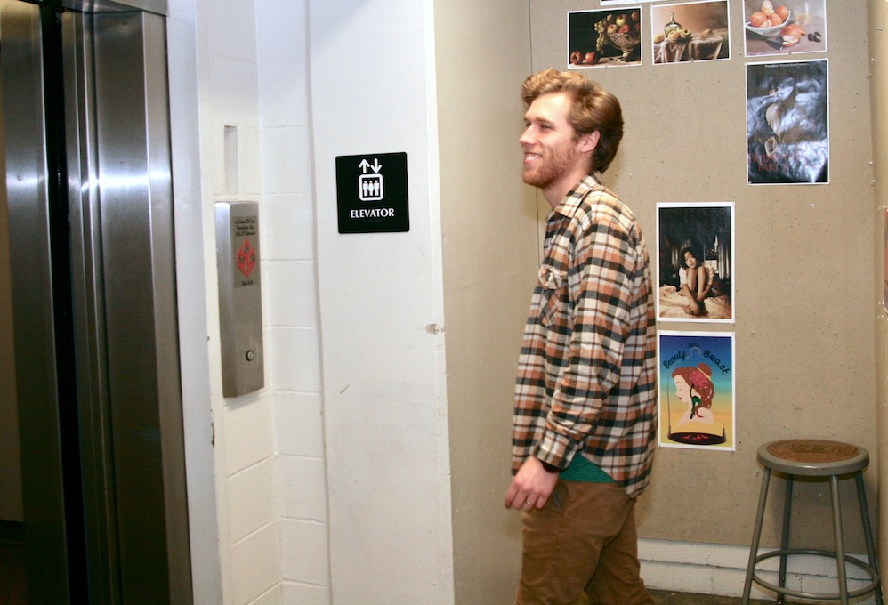 man standing in front of elevator