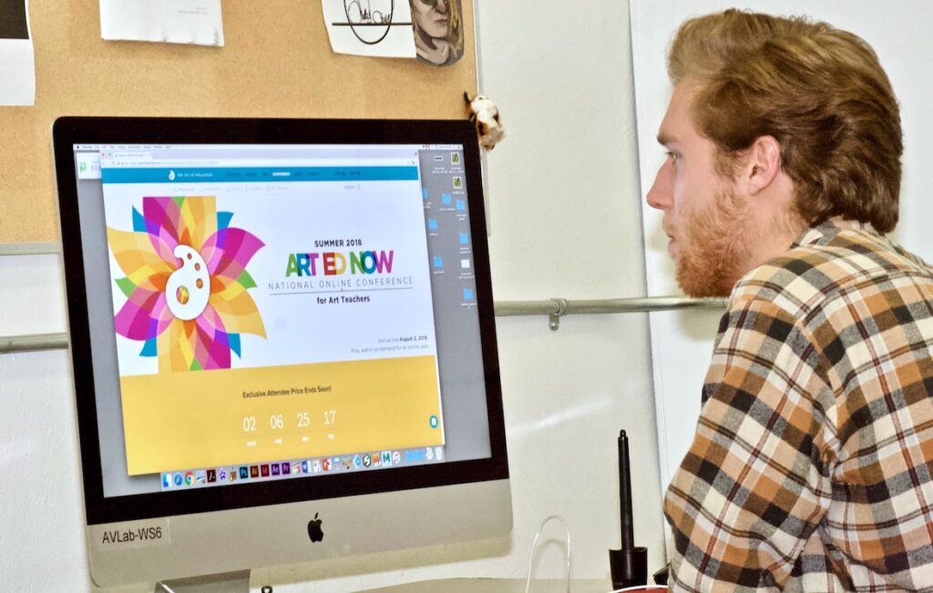 teacher looking at AOE website
