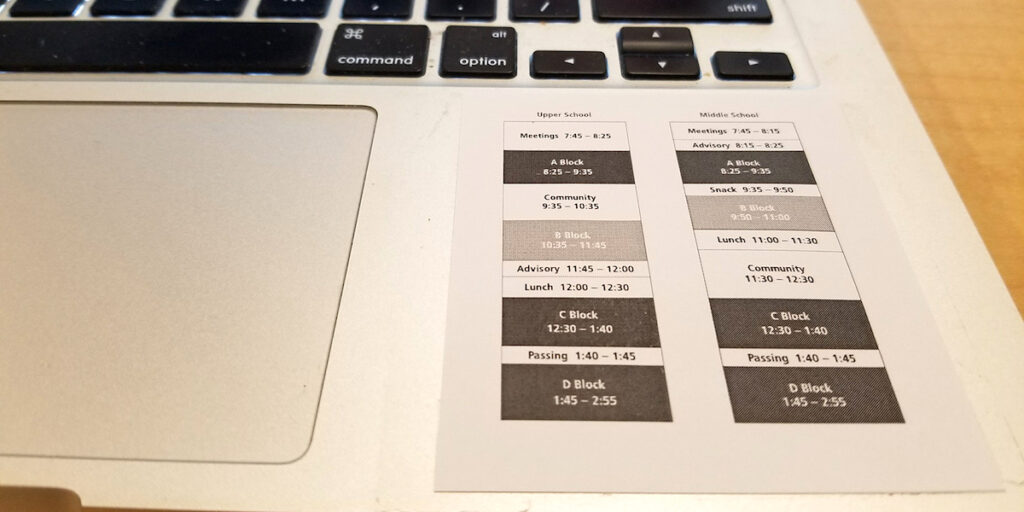 schedule taped to laptop