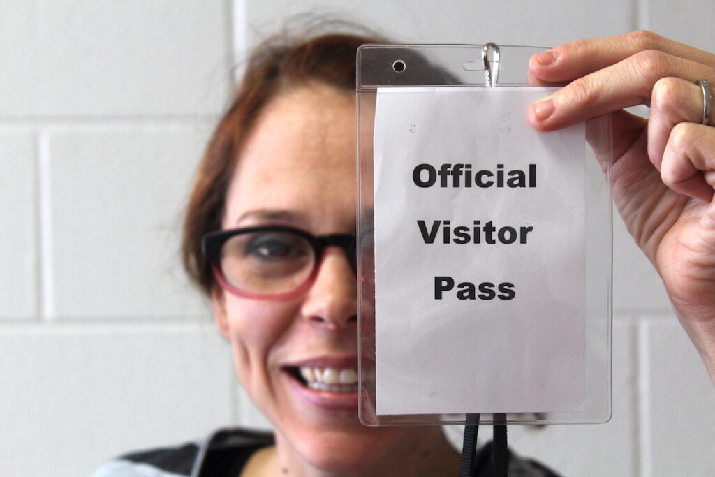 teacher with visitor pass