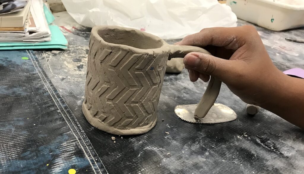 adding handle to clay mug