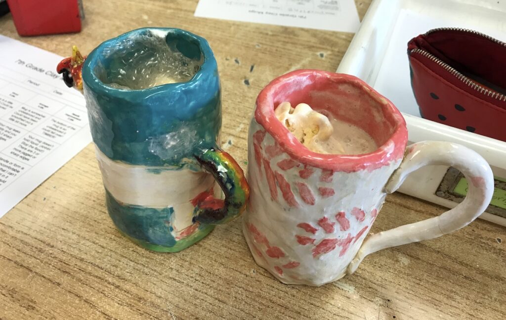 clay mugs with hot cocoa