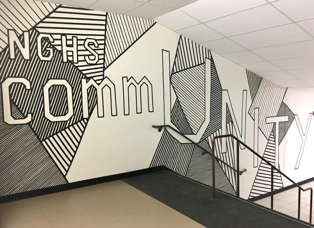 large tape mural with theme of community