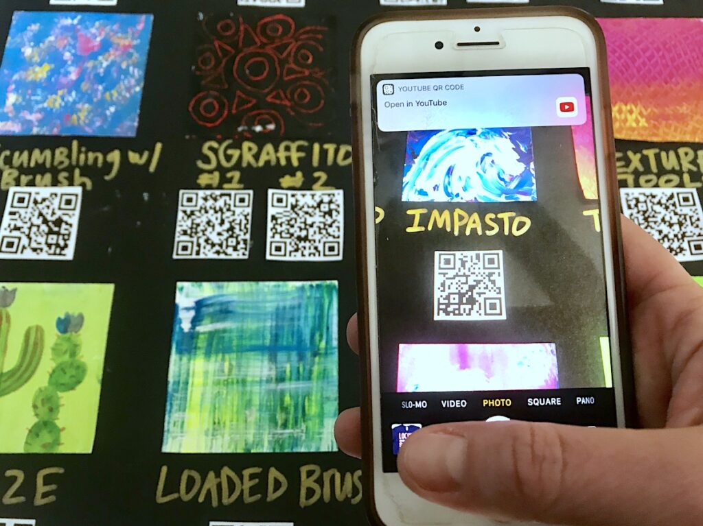 scanning QR code on interactive anchor chart