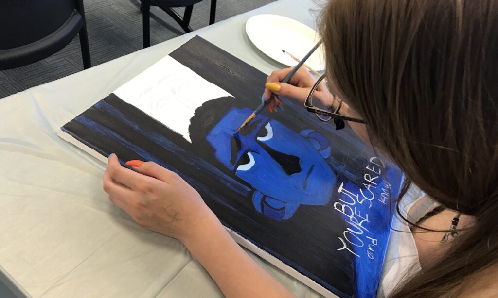 student creating artwork