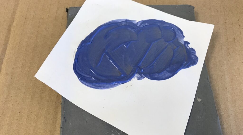 paper stencil with colored clay