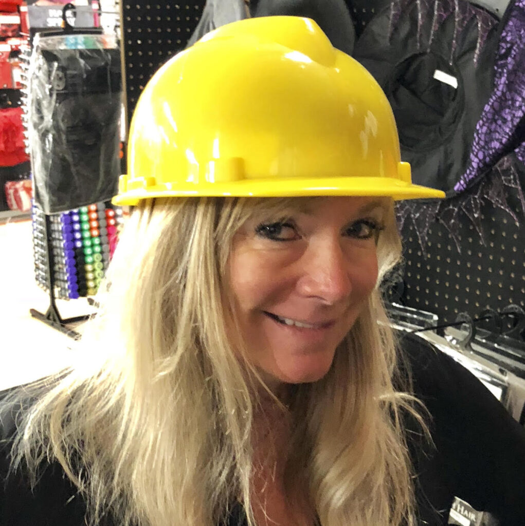 Debi wearing a construction hat