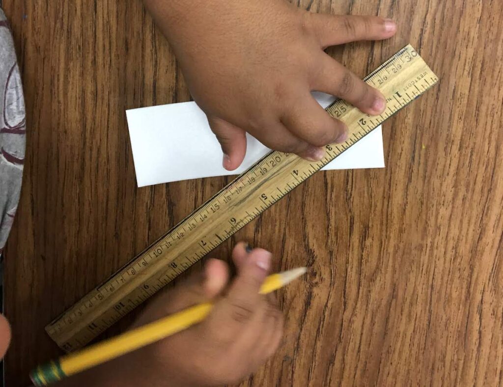 student using ruler