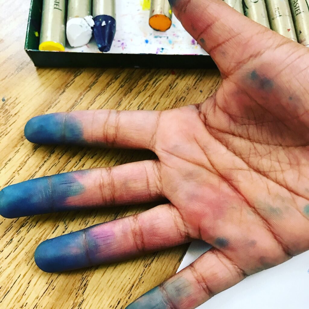 hands stained with ink 