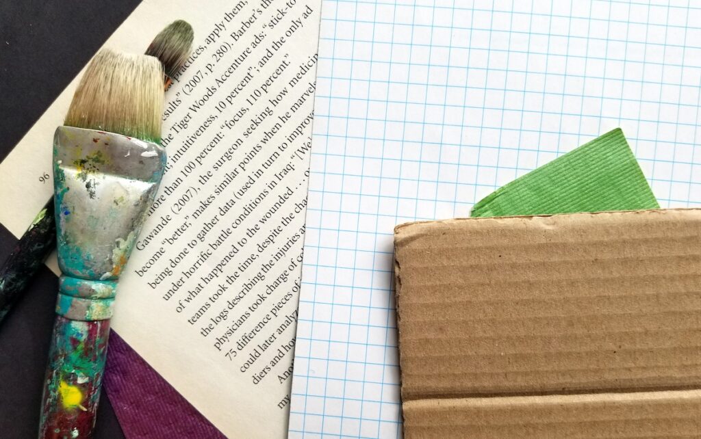 book page graph paper and cardboard with brush