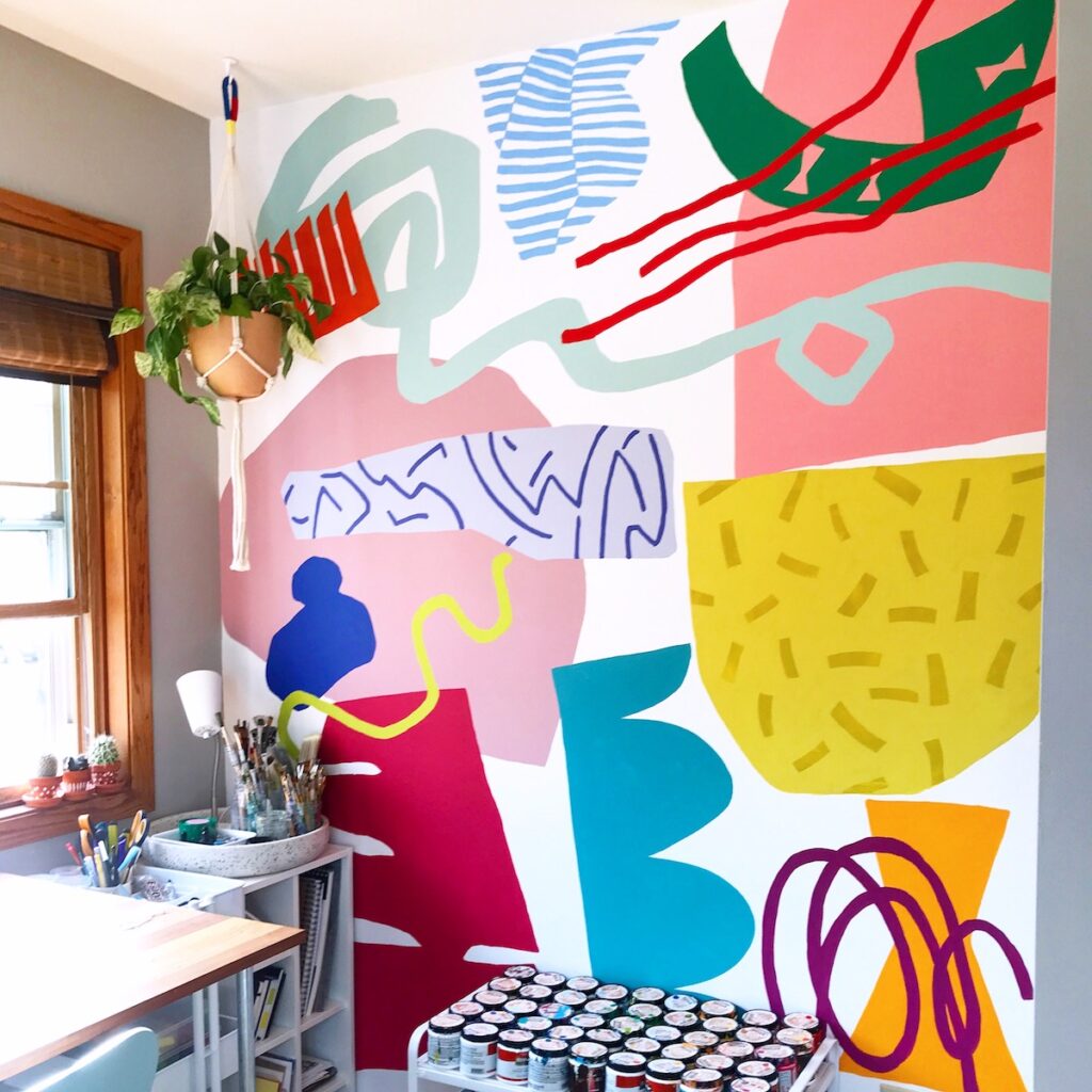 studio space with abstract mural on the wall