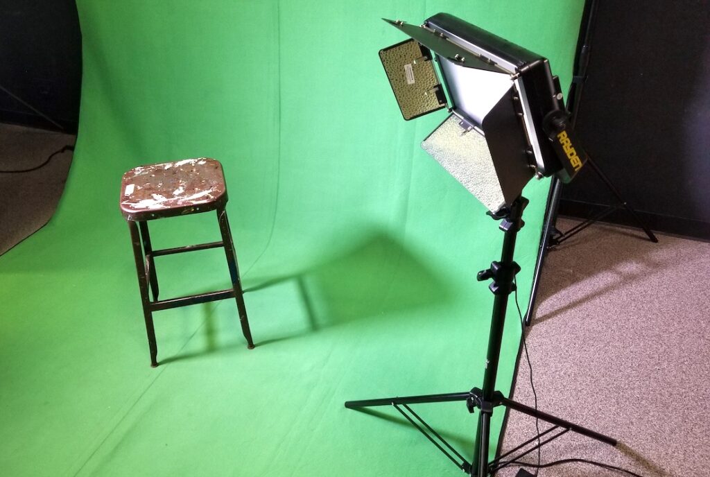 Photo of green screen lights and a chair