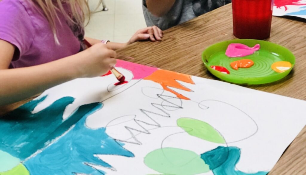 Image of student working on artwork