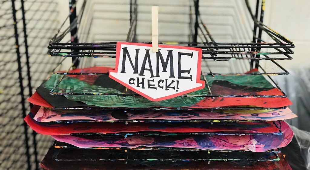Image with a dry rack with a name check reminder