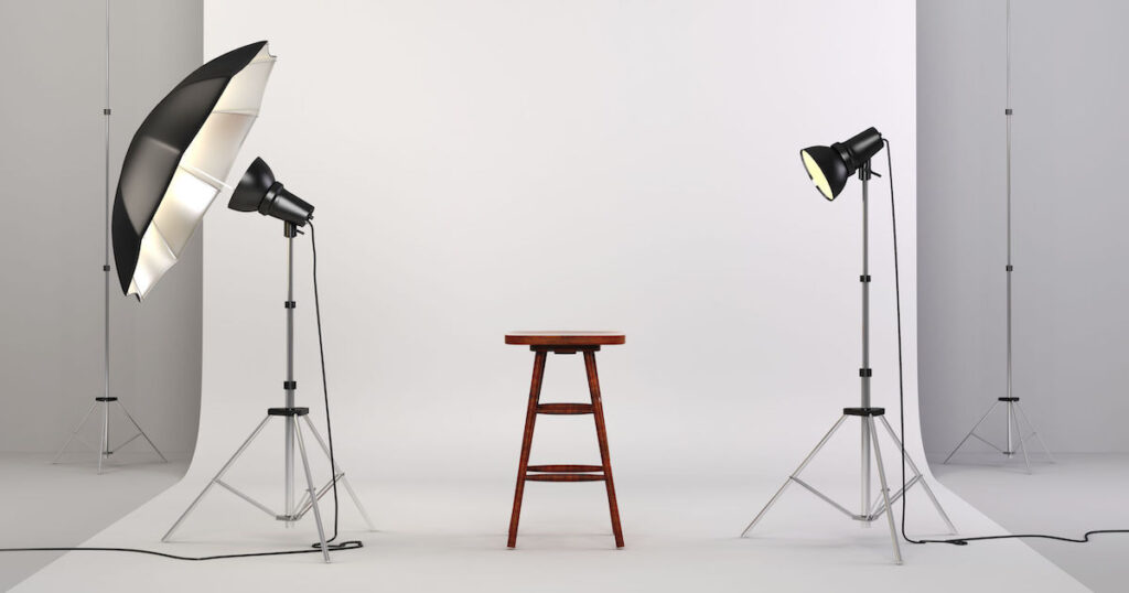 3d studio setup with lights, a wooden chair and white background