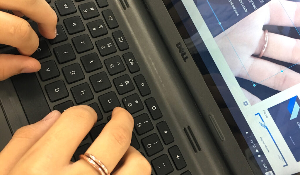 teacher using a computer to grade