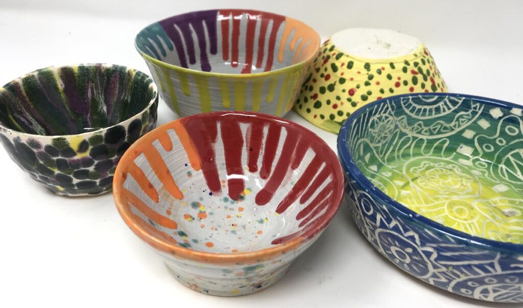 colored bowls that were created by throwing them on the wheel