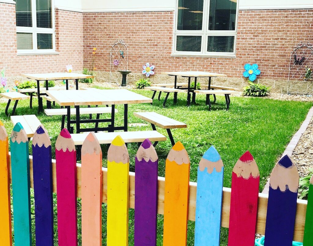 fence painted to look like colored pencils
