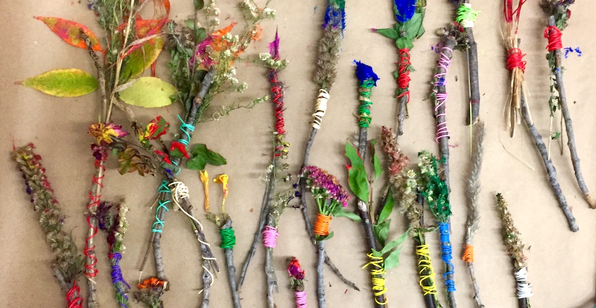 natural paintbrushes made of sticks and flowers