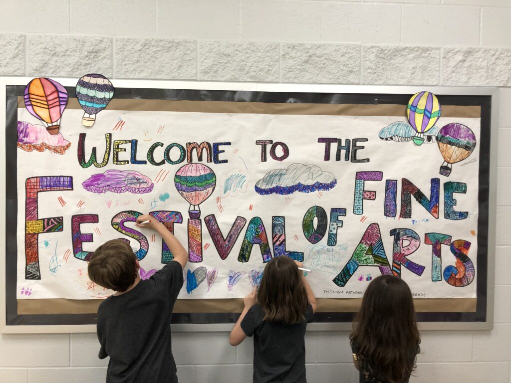 students decorating banner