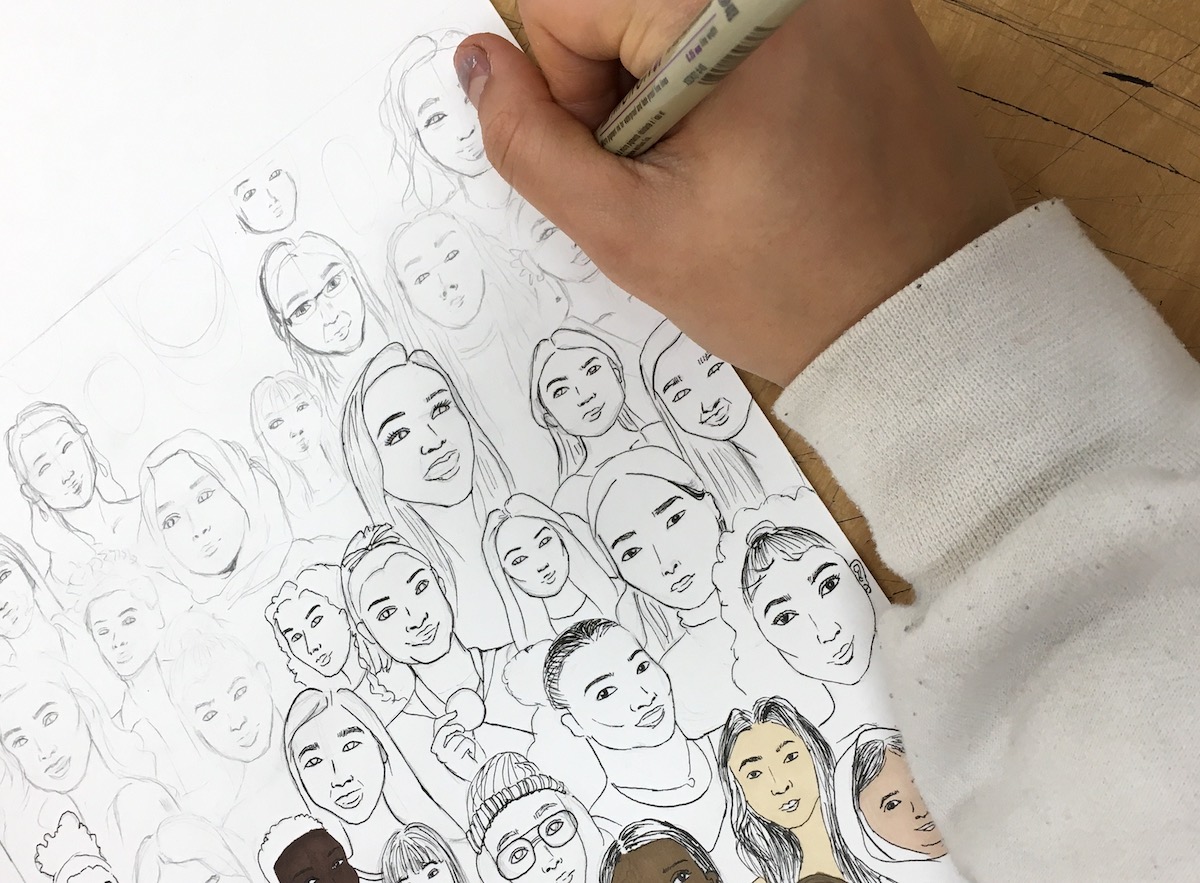 student drawing portraits