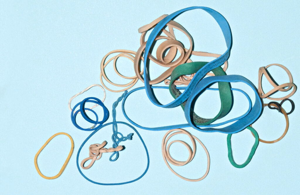 blue and brown rubber bands on a light blue background