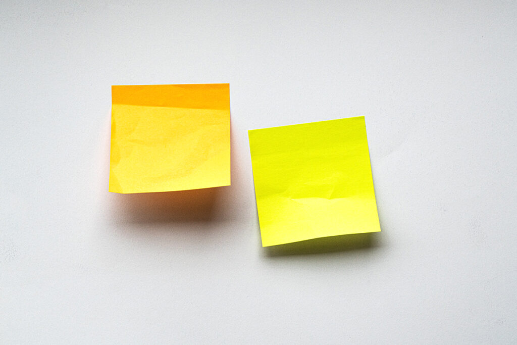 two sticky notes on white background