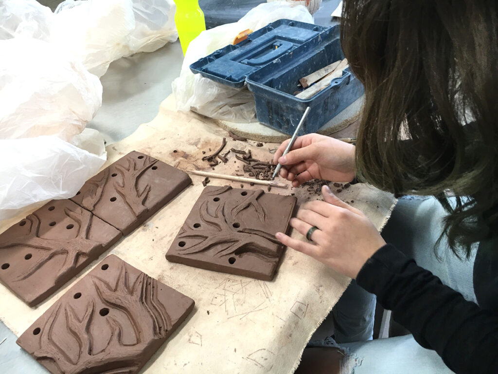 carving trees out of clay slabs