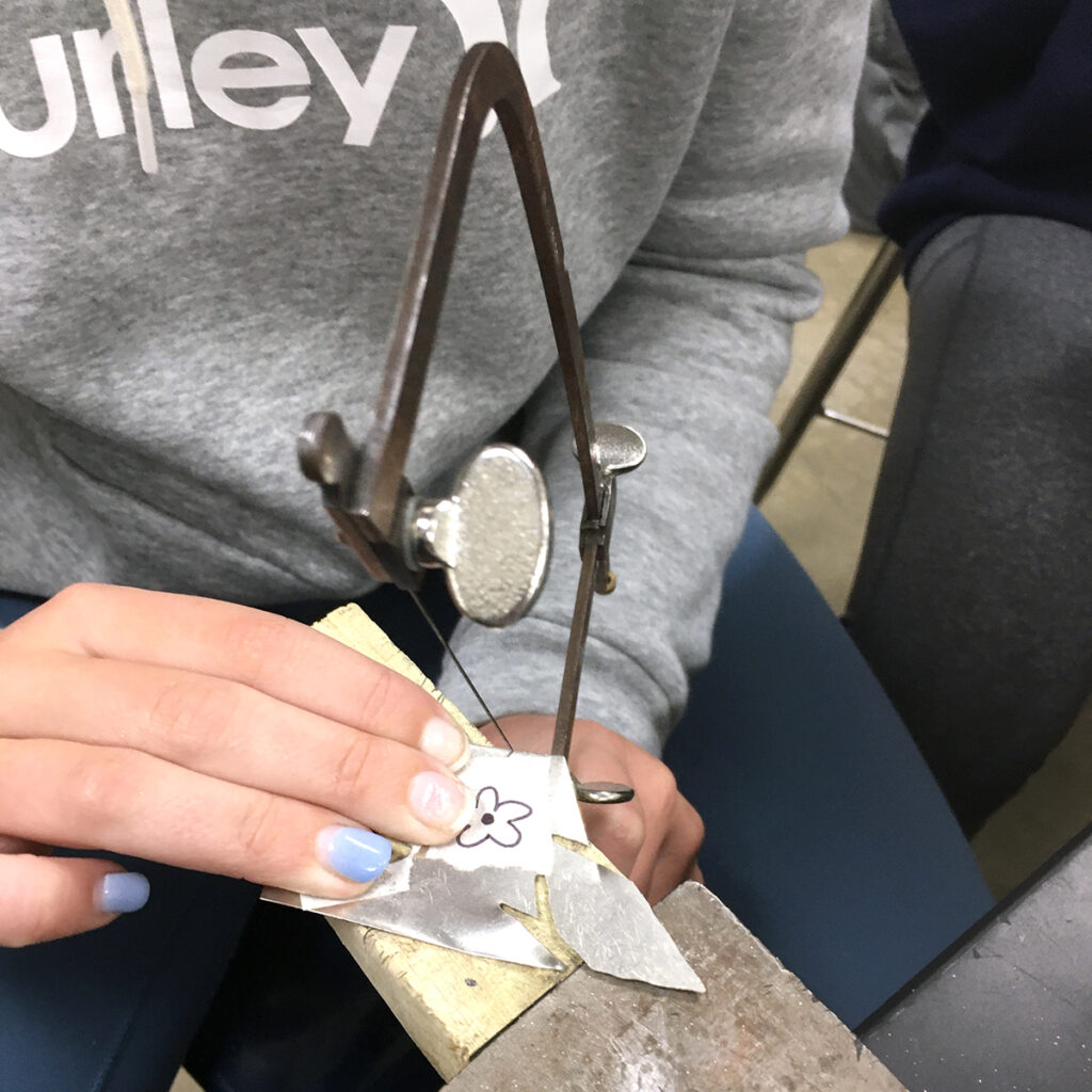 cutting flower out of metal