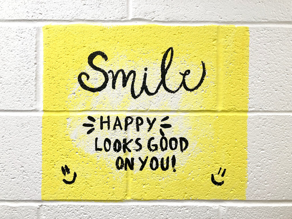 smile quote on wall