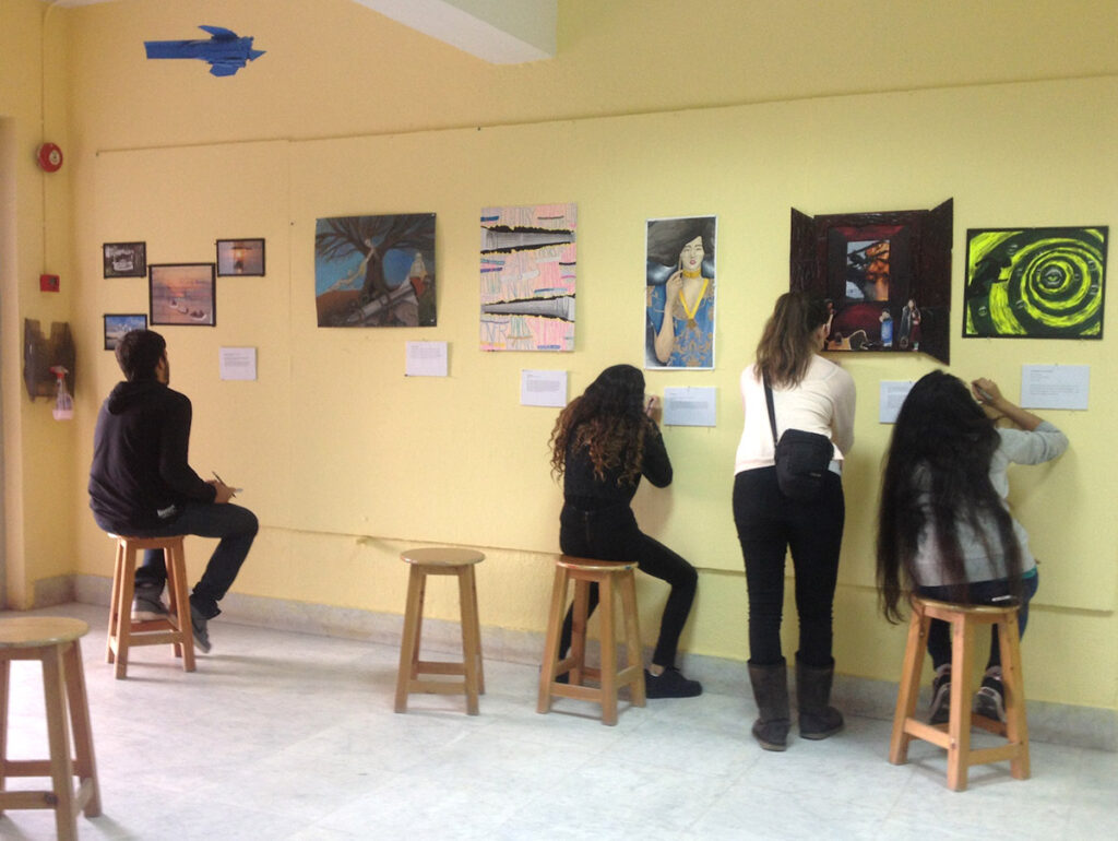 students examining art 