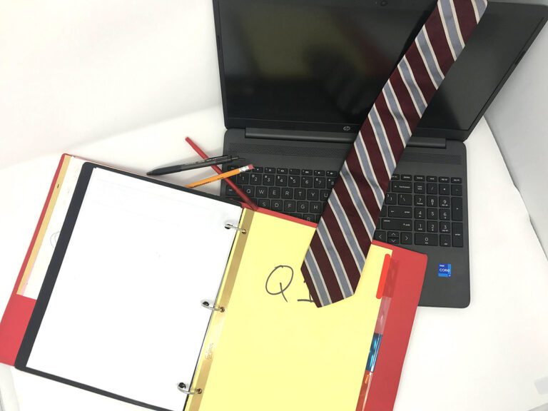laptop, binder, tie