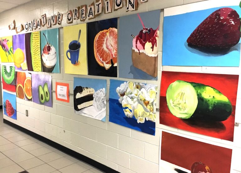 hallway display of food paintings