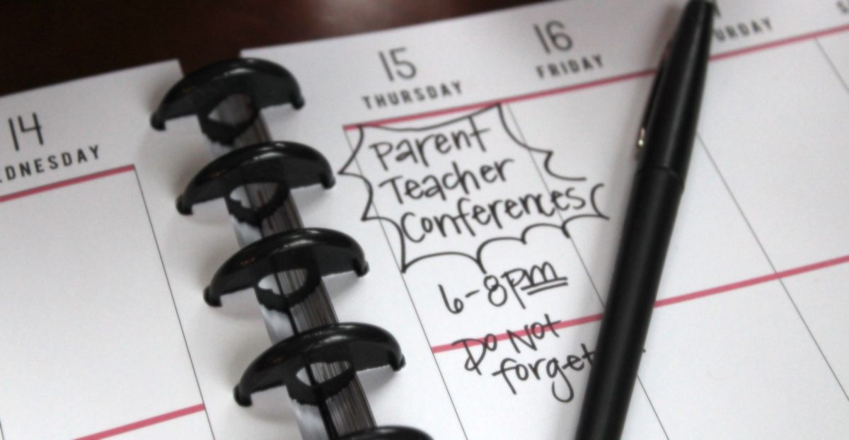 planner with "conferences" written down