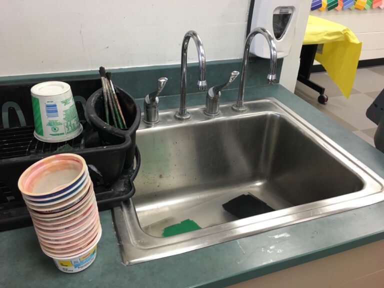 sink with water cups next to it