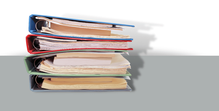 pile of curriculum binders