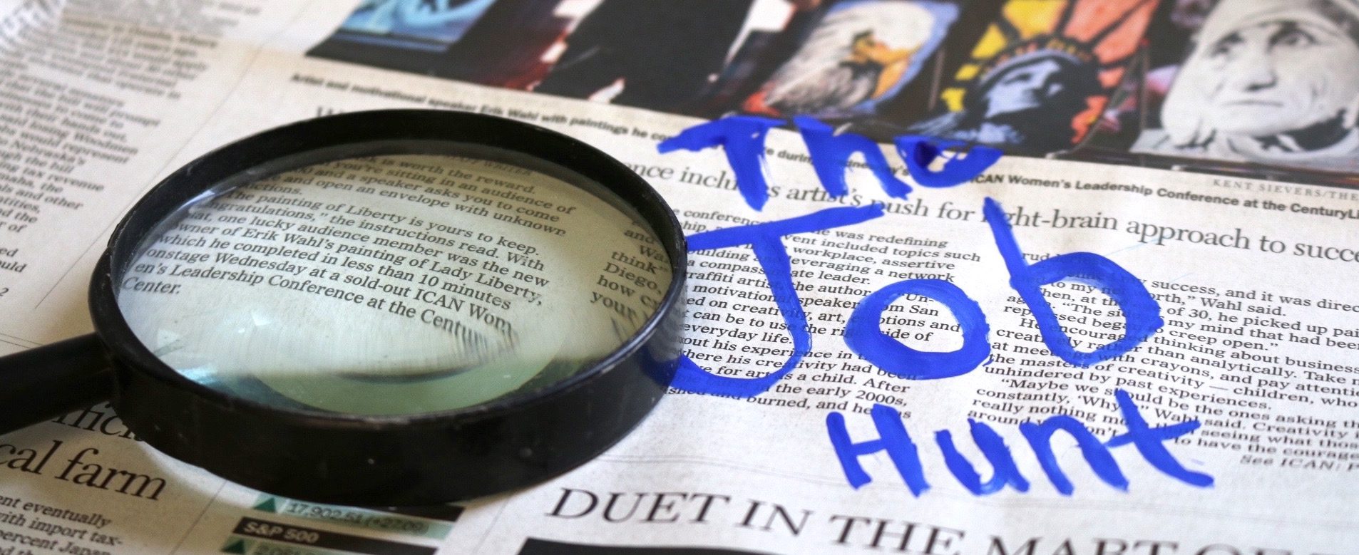 newspaper and magnifying glass