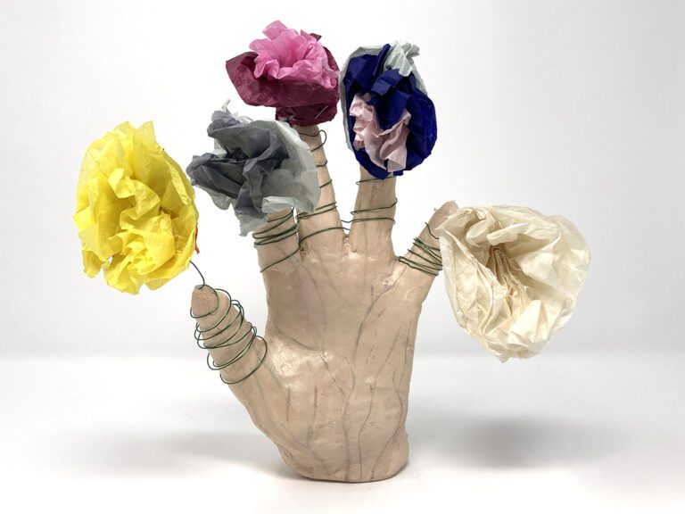 hand sculpture with flowers