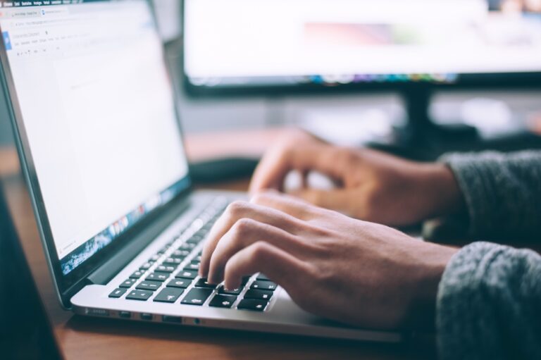 person typing on computer