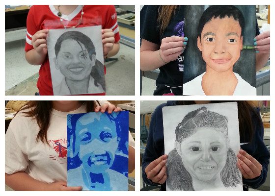 students showing off portraits