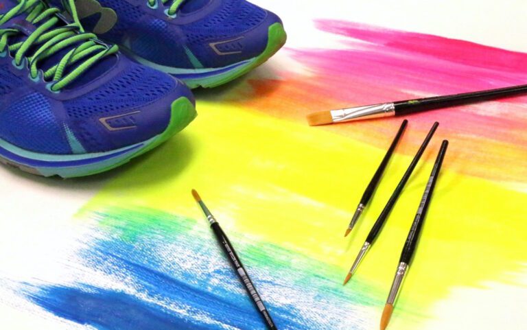 running shoes on top of painting