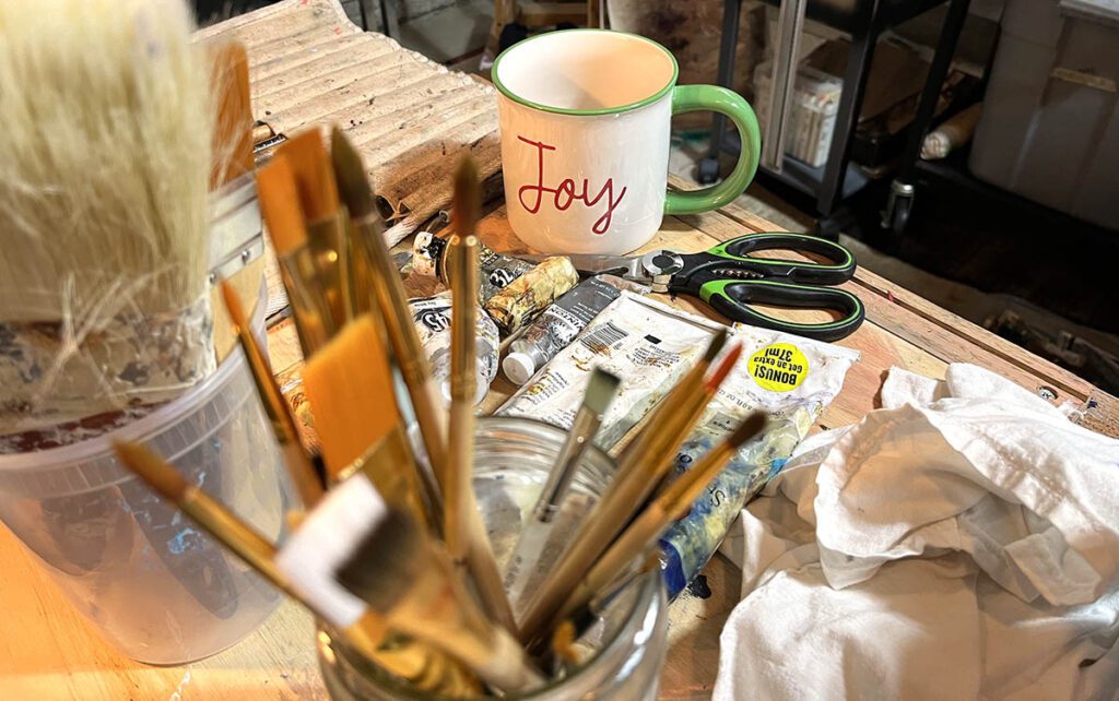 art supplies and joy mug